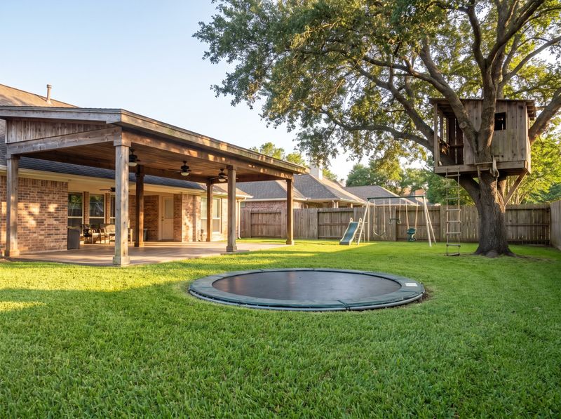Backyard Play Area with Wooden Treehouse