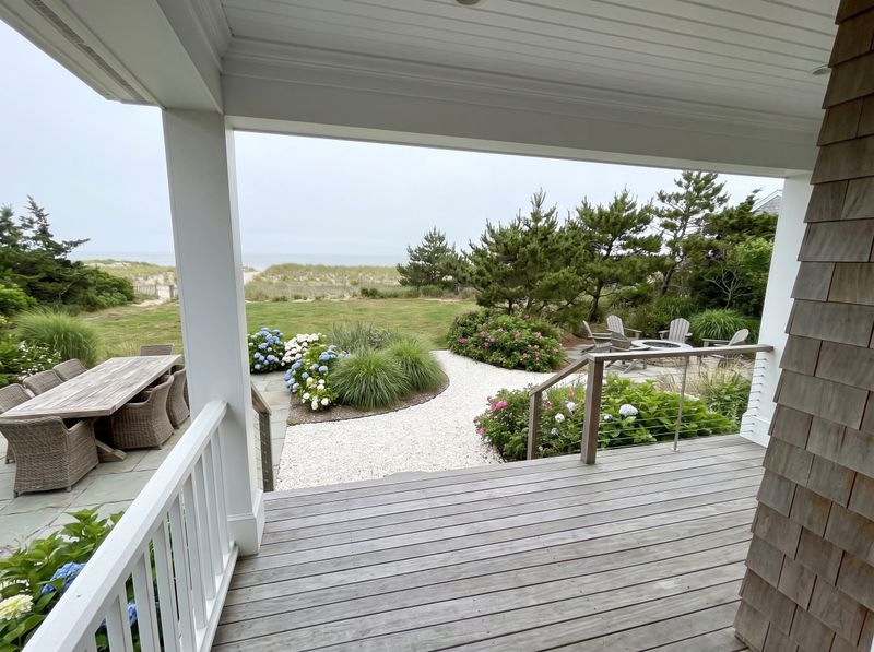Coastal Backyard with Fire Pit and Dining