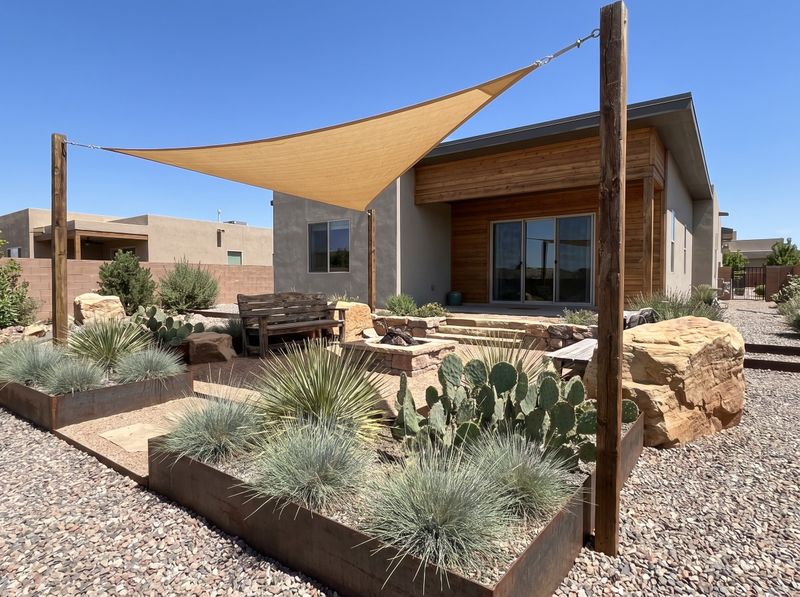 Tan Shade Sail Over Gravel Patio