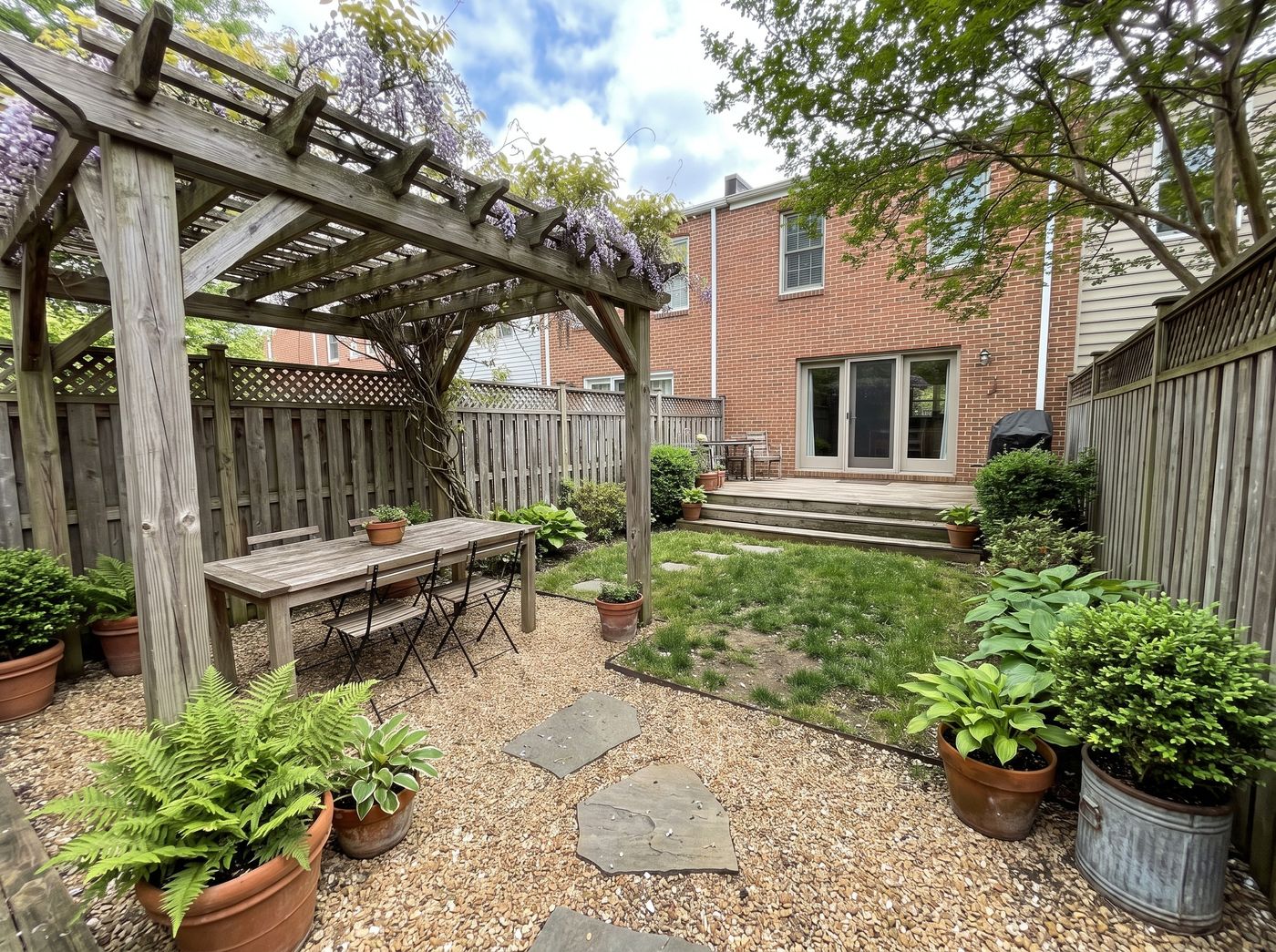 Weathered Timber Pergola over Gravel Dining
