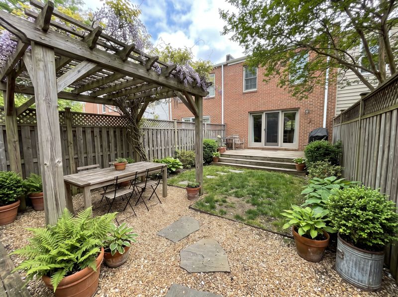 Weathered Timber Pergola over Gravel Dining