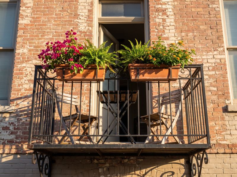 Compact Iron Balcony with Terracotta Planters