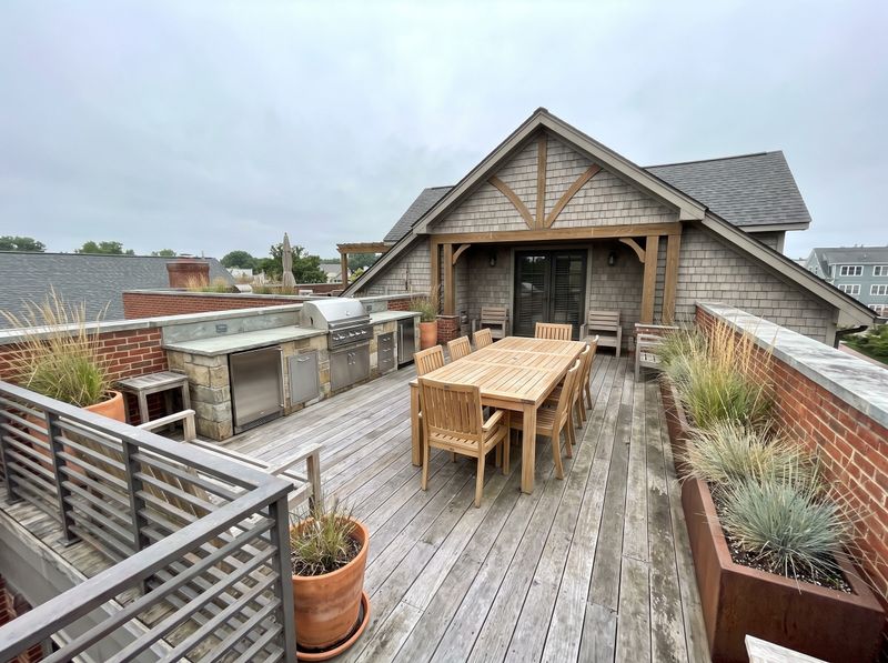 Rooftop Deck Featuring Stone Outdoor Kitchen