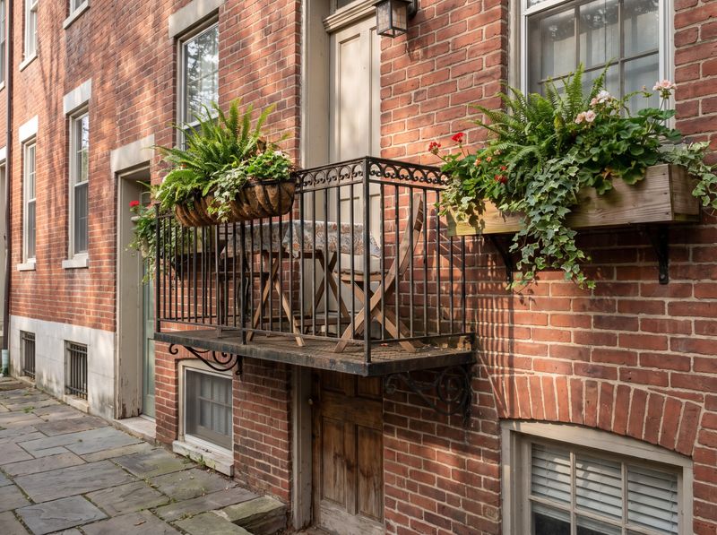 Wrought-Iron Balcony with Window Boxes