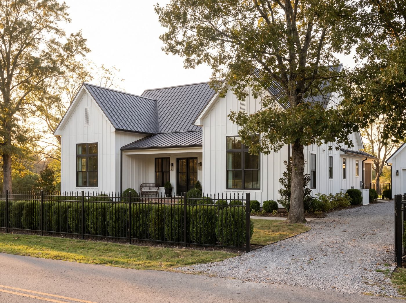 Black Aluminum Fence Along Front Yard Hedge