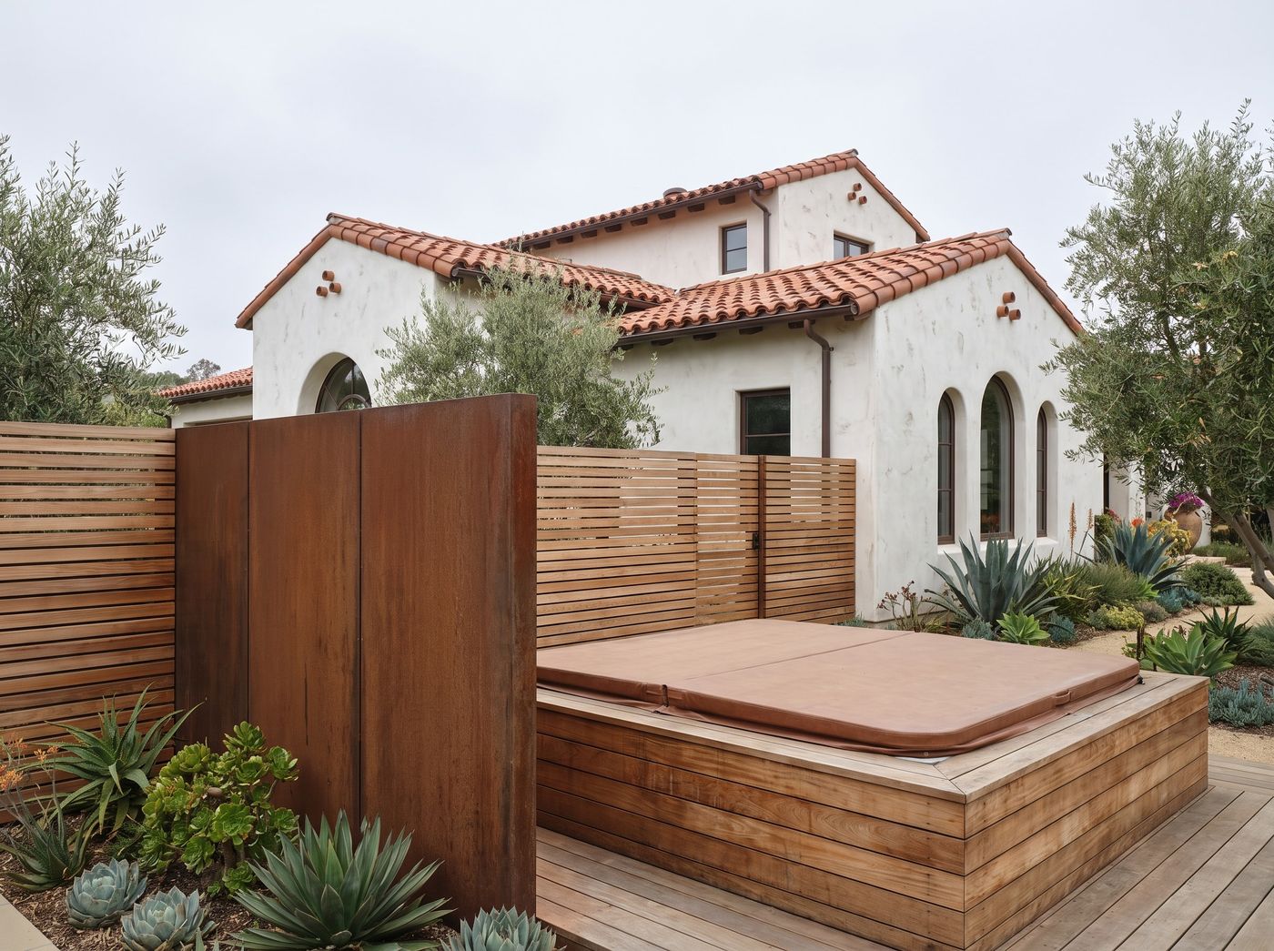 Corten Metal Privacy Screen Enclosing Hot Tub