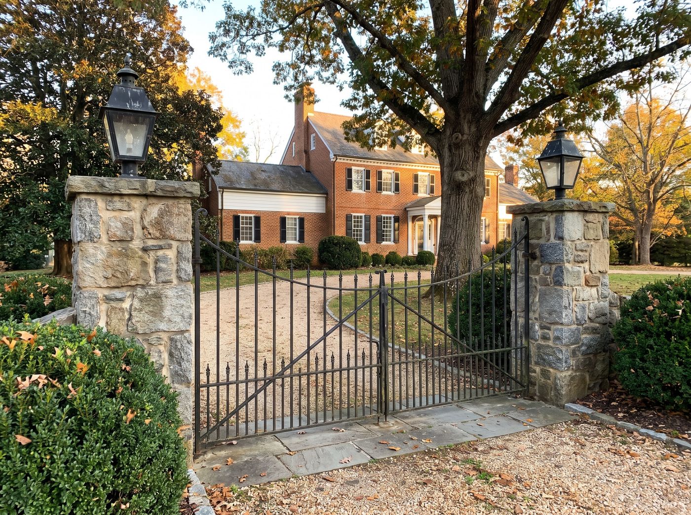 Driveway Gate Framed by Stone Pillars
