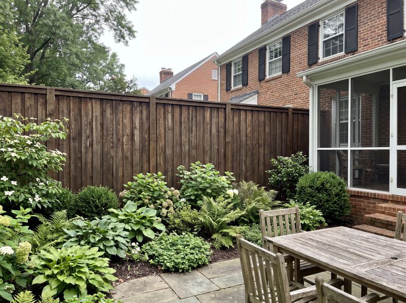 Tall Board-and-Batten Fence Along Garden