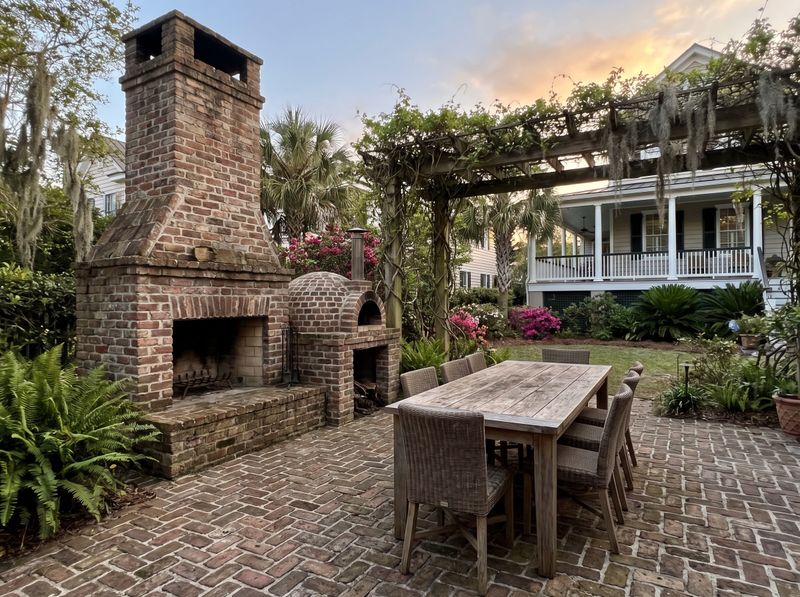 Brick Fireplace Beside Garden Pizza Oven