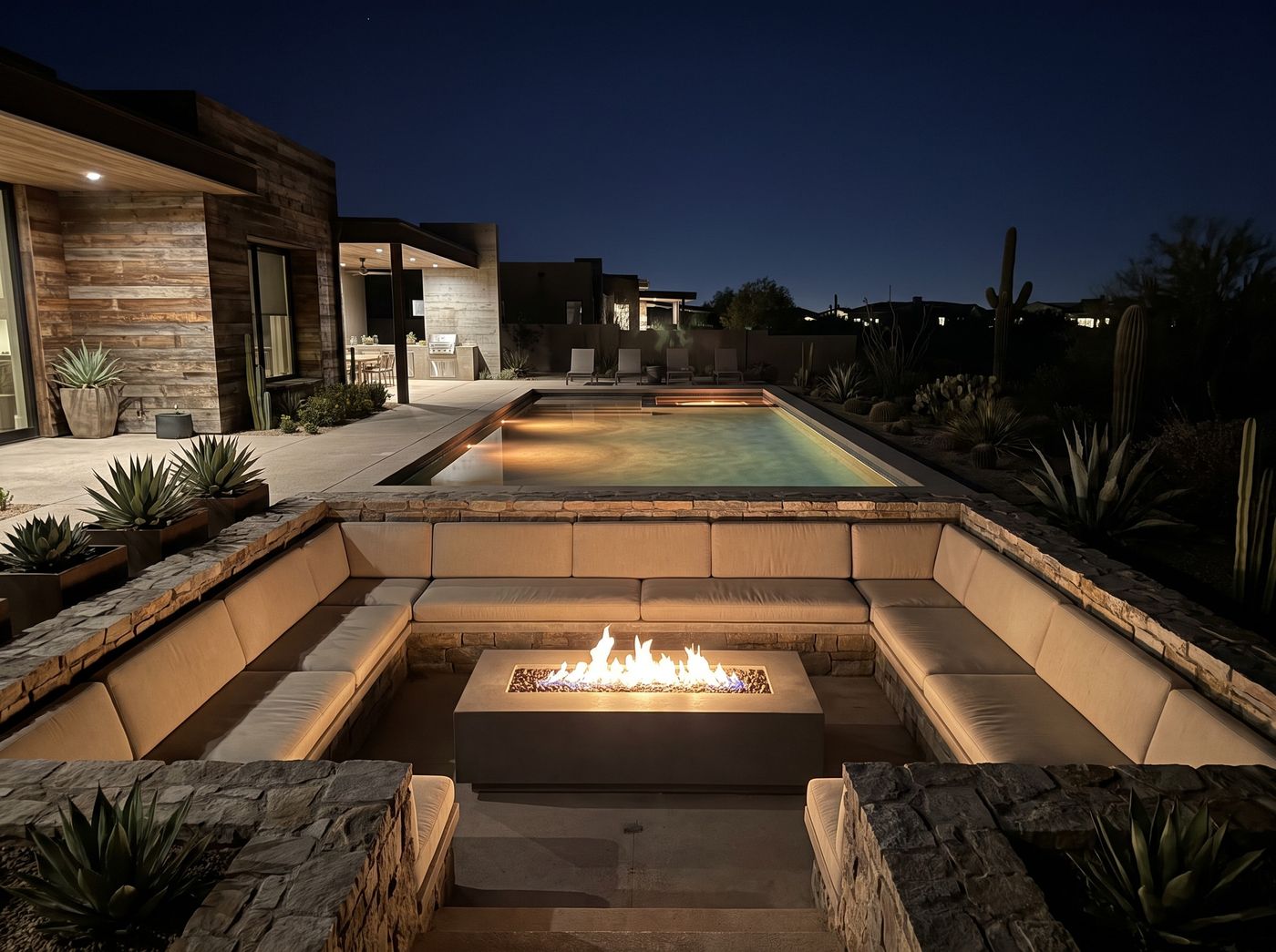 Sunken Conversation Pit Beside Illuminated Pool