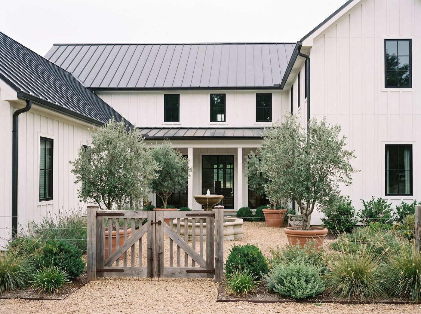 Gravel Courtyard Entry with Stone Fountain