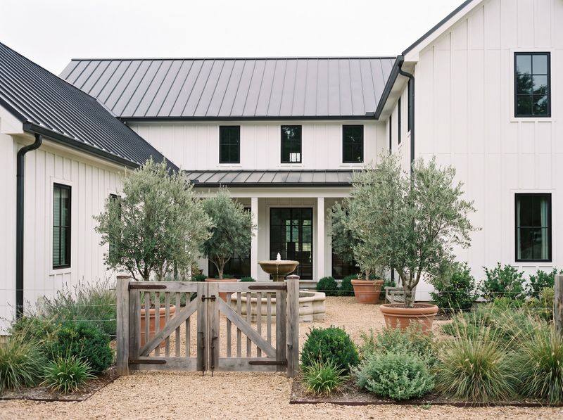 Gravel Courtyard Entry with Stone Fountain