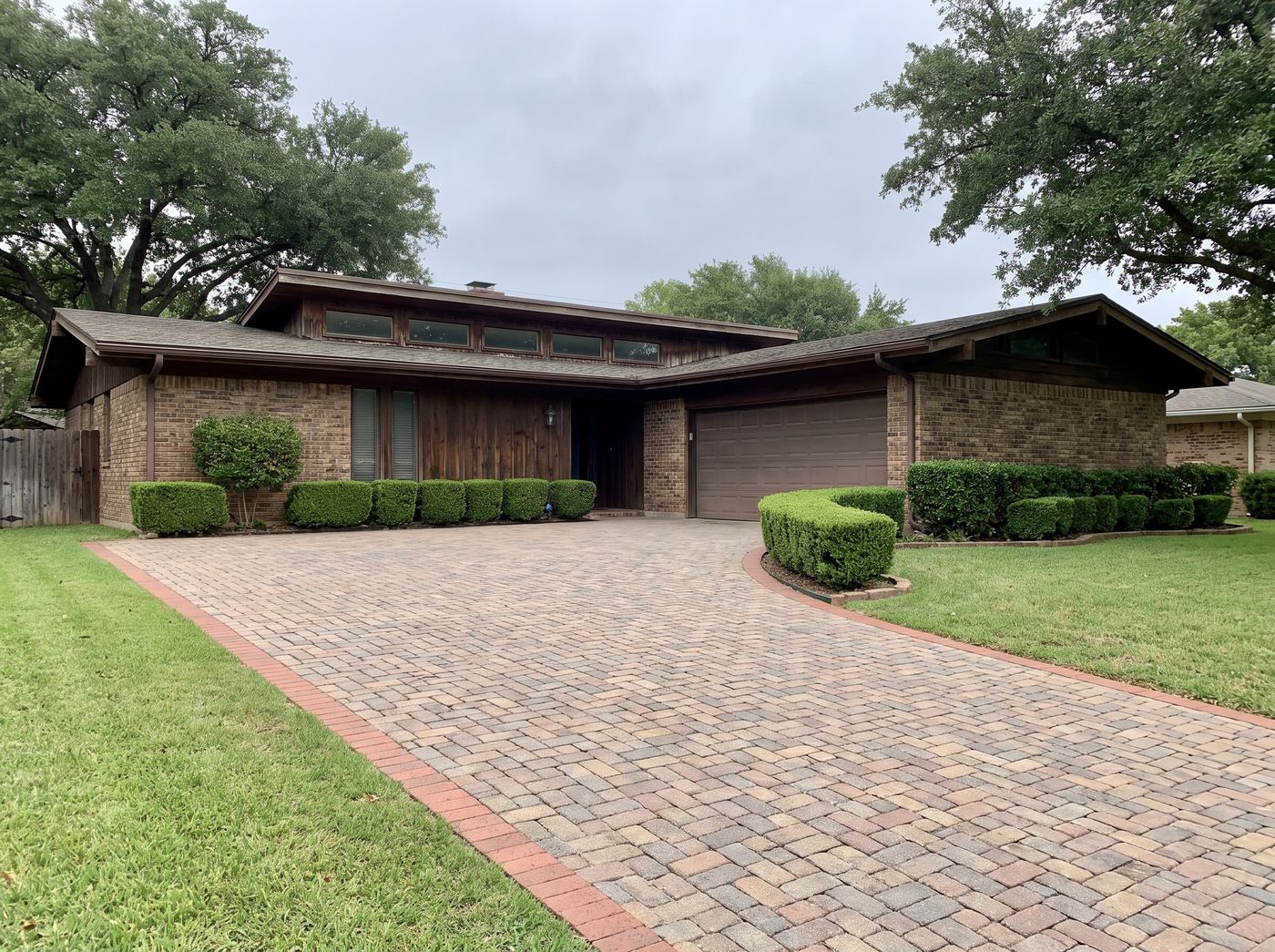 Sweeping Paver Driveway with Brick Border