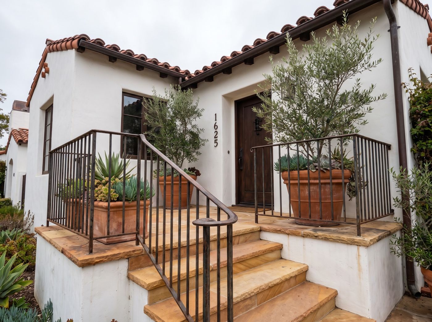 Terracotta Planters Framing Mediterranean Entry Steps