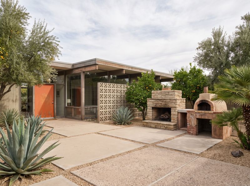 Stone Fireplace Beside Outdoor Pizza Oven