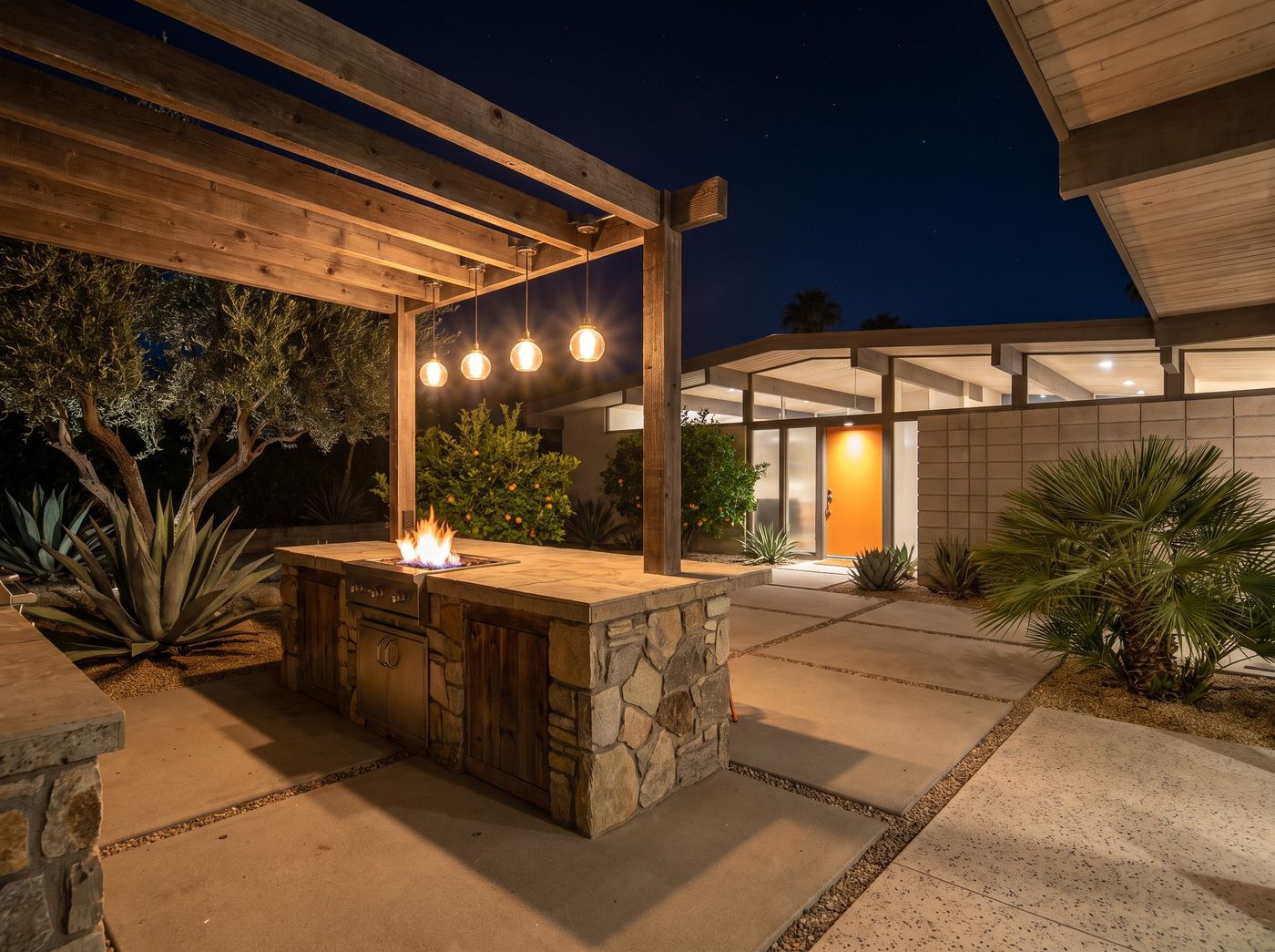 Stone Kitchen Island Under Timber Pergola