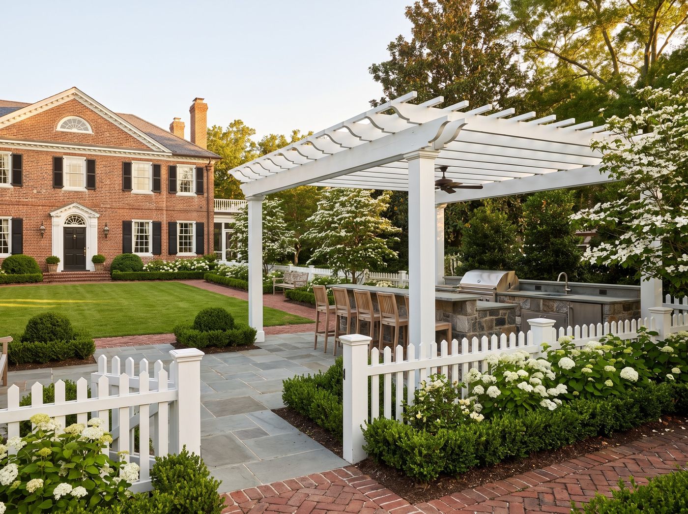 White Pergola Outdoor Kitchen with Bar Seating