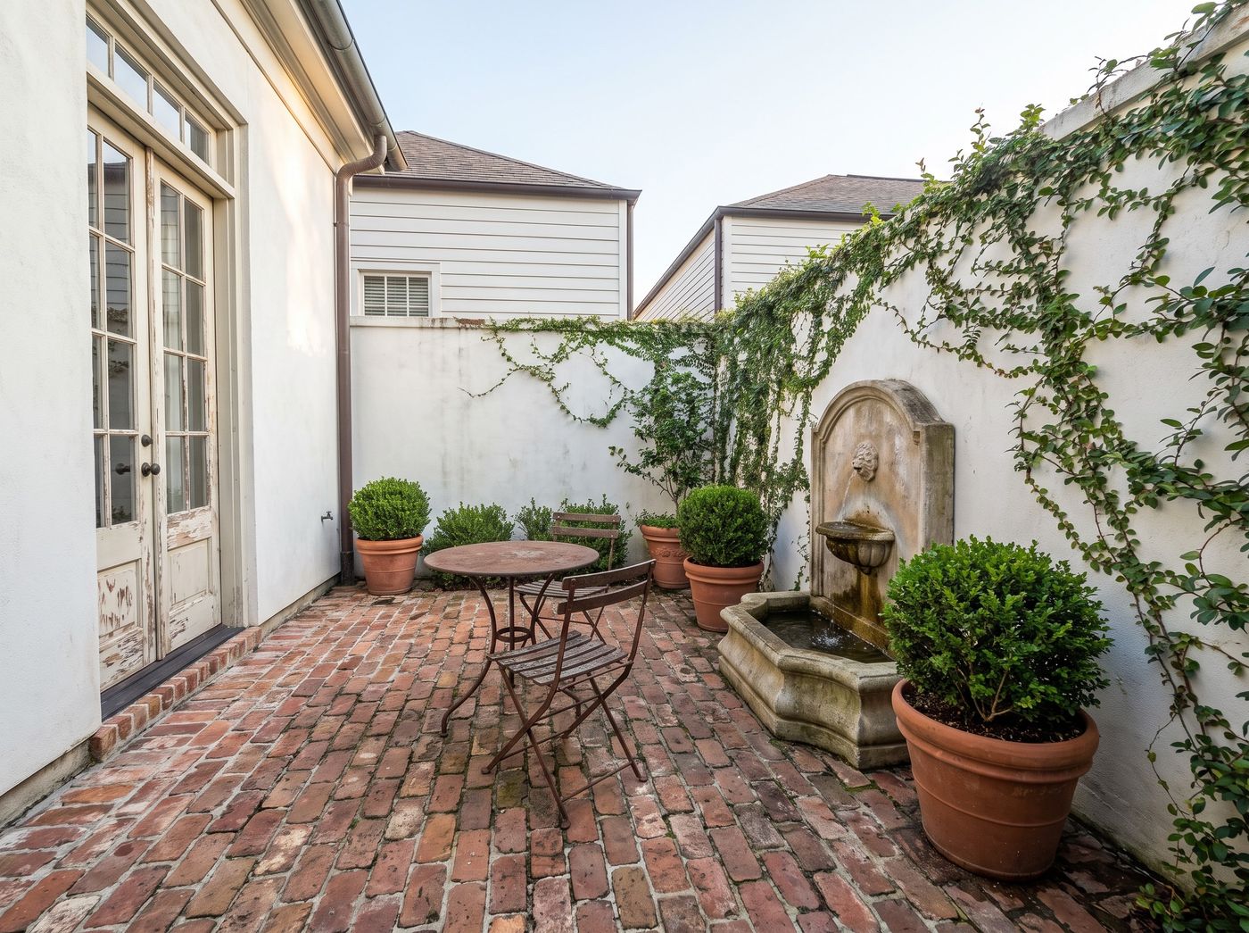 Brick Courtyard with Wall Fountain