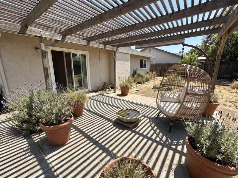 Wooden Pergola Shading a Concrete Patio