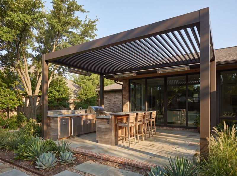 Dark Aluminum Pergola Sheltering Outdoor Kitchen