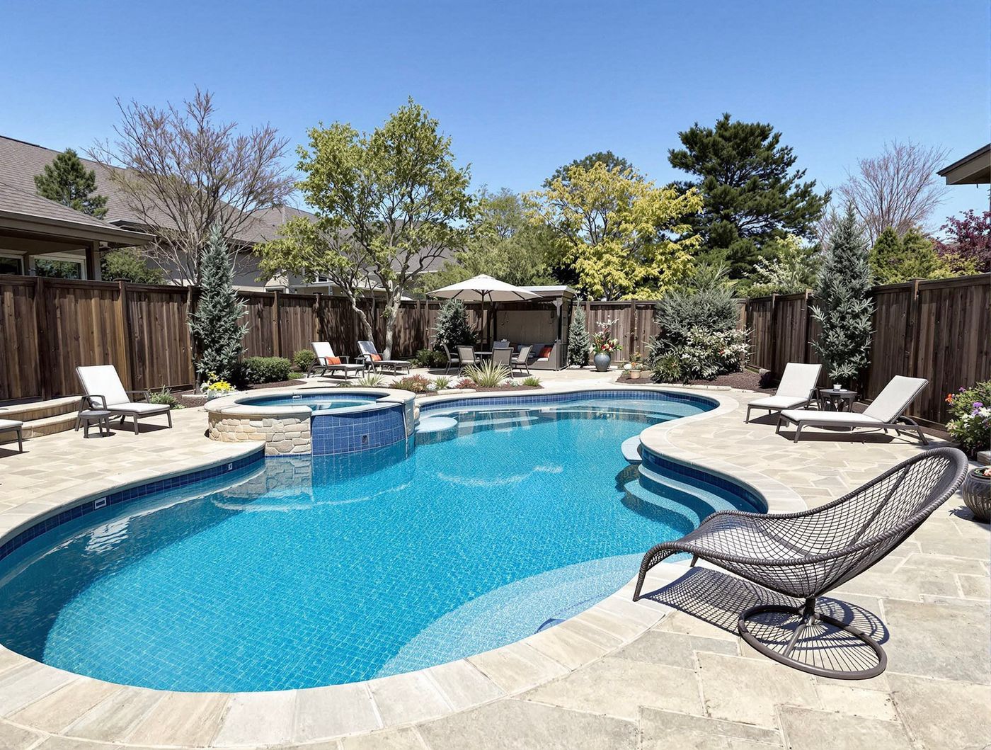 Kidney Pool with Raised Stone Spa and Loungers