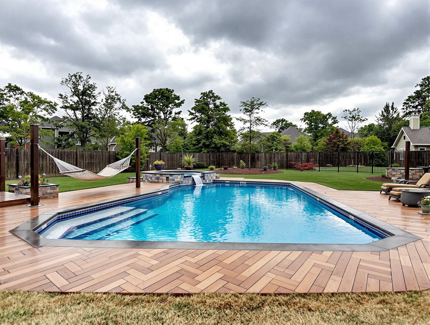 Rectangular Pool with Waterfall and Herringbone Deck