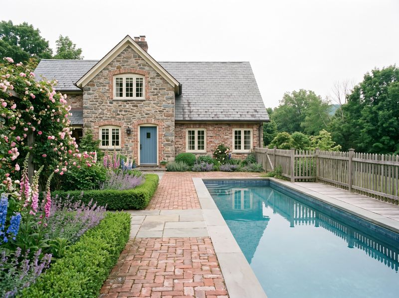 Rectangular Lap Pool Beside Stone Cottage