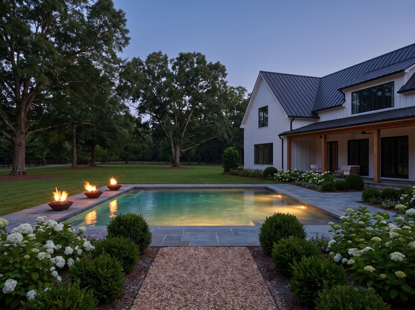 Rectangular Pool Flanked by Fire Bowls