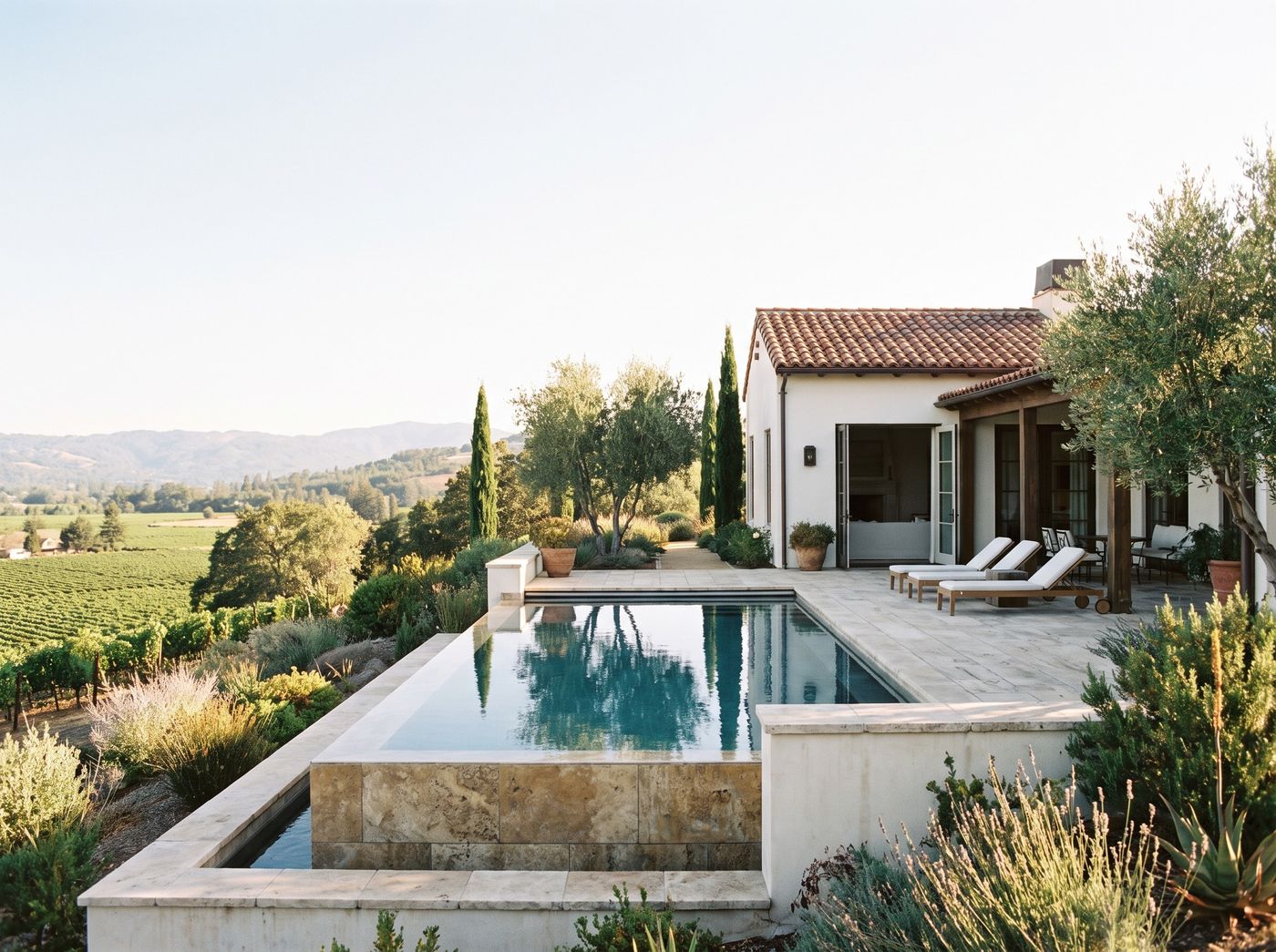 Travertine Infinity Pool with Hillside View