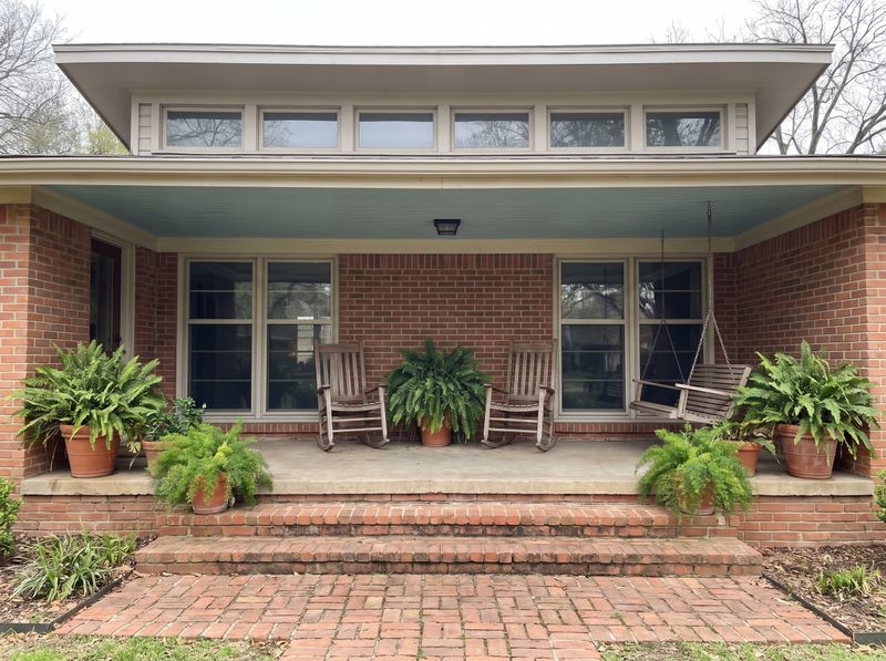 Brick Front Porch with Wooden Rockers